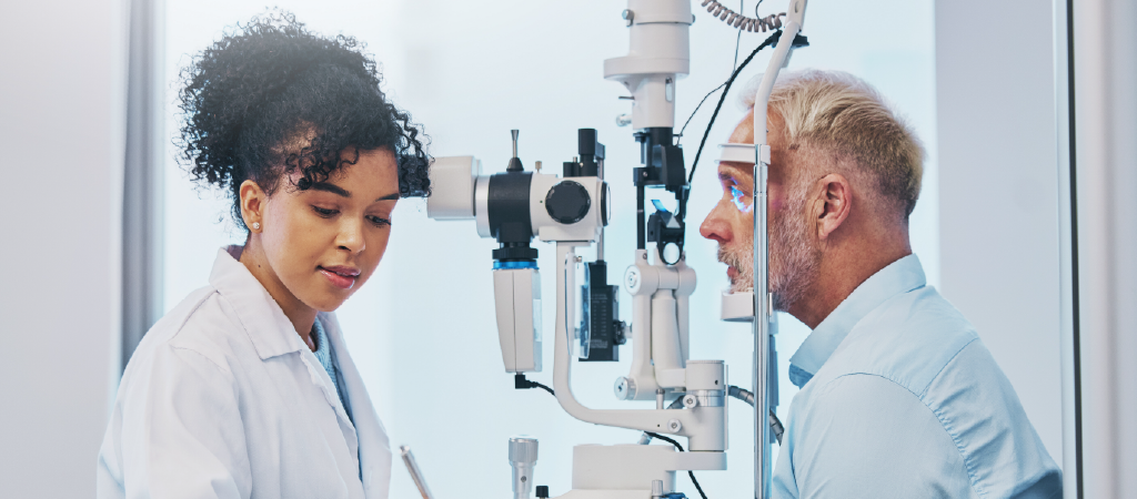 doctor and patient performing an eye exam